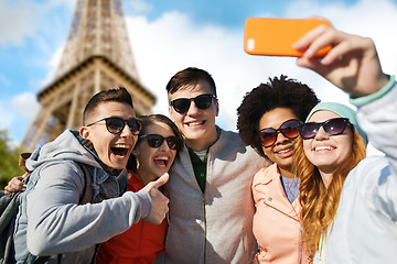 Image showing smiling friends taking selfie with smartphone