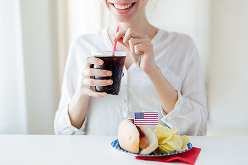 Image showing close up of happy woman drinking coca cola