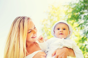 Image showing happy mother with little baby in park