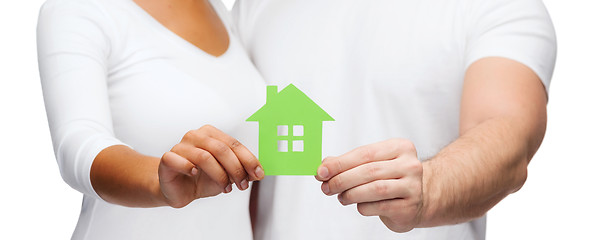 Image showing couple hands holding green house