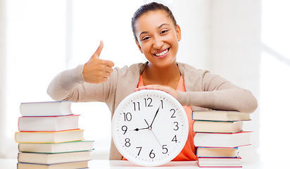 Image showing attractive woman with white clock