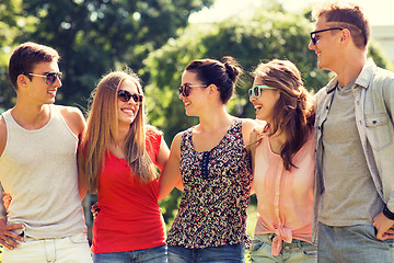 Image showing group of smiling friends outdoors