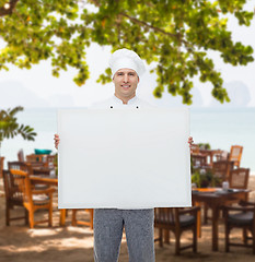 Image showing happy male chef cook holding white blank big board