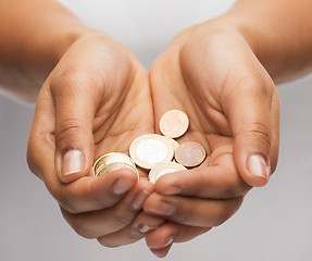 Image showing womans cupped hands showing euro coins
