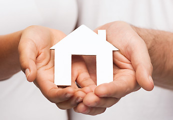 Image showing couple hands with paper house