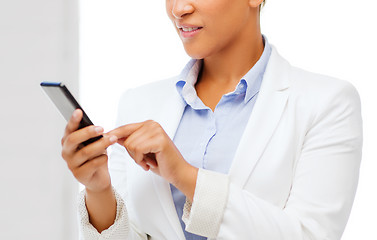 Image showing african businesswoman with smartphone in office