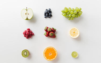 Image showing ripe fruits and berries on white surface