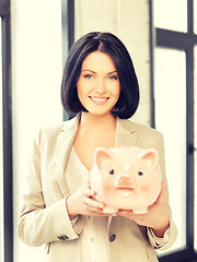 Image showing lovely woman with piggy bank