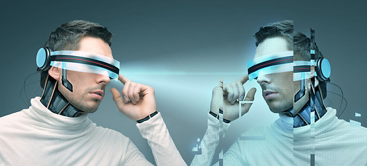 Image showing man with futuristic 3d glasses and sensors