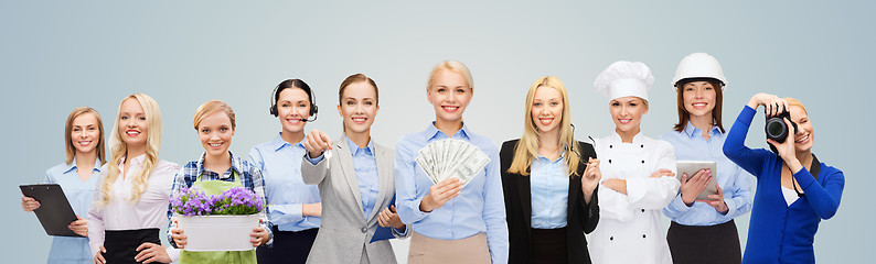 Image showing woman holding money over professional workers