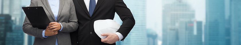 Image showing businesspeople with clipboard and helmet