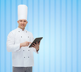 Image showing happy male chef cook holding tablet pc