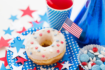 Image showing donut with juice and candies on independence day