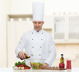 Image showing happy male chef cook cooking food