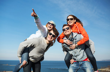 Image showing happy friends in shades having fun outdoors