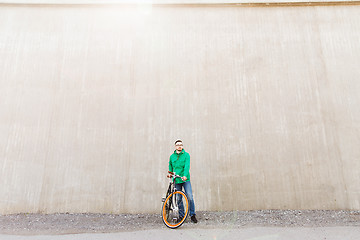 Image showing happy young hipster man with fixed gear bike