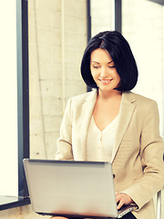 Image showing happy woman with laptop computer