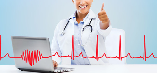 Image showing female doctor with laptop pc showing thumbs up