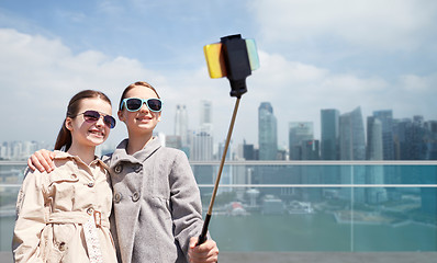 Image showing girls with smartphone selfie stick in singapore