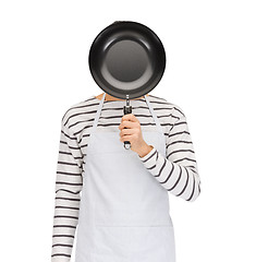 Image showing man or cook in apron hiding face behind frying pan