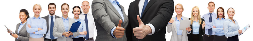 Image showing businessman and businesswoman showing thumbs up