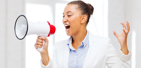 Image showing strict businesswoman shouting in megaphone