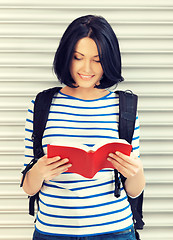 Image showing woman with bag and book