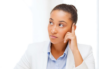 Image showing businesswoman working with calculator in office