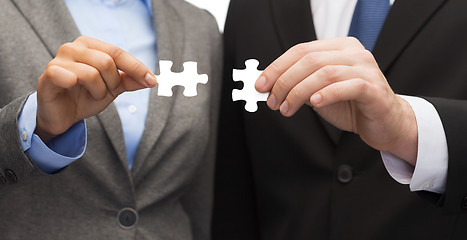 Image showing businessman and businesswoman with puzzle pieces