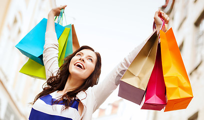 Image showing woman with shopping bags in ctiy