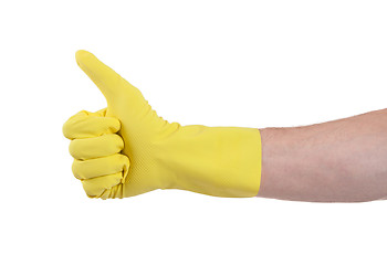 Image showing Yellow glove for cleaning show thumbs up