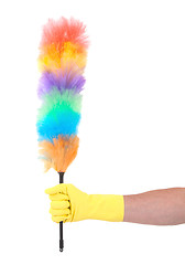 Image showing Man with yellow cleaning glove holding a duster