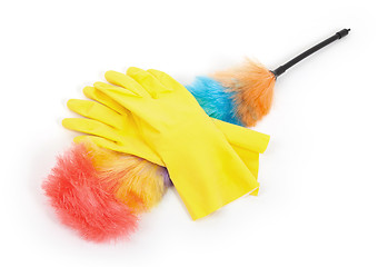 Image showing Yellow cleaning gloves with a duster