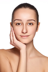 Image showing Portrait of beautiful girl stroking her face with healthy skin 