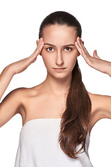 Image showing Beautiful young woman with headache touching her temples