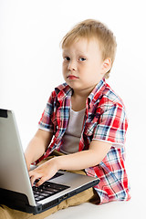 Image showing child with a laptop. studio