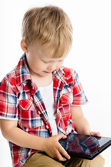 Image showing boy with a Tablet PC. studio