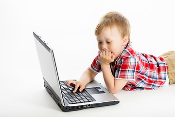 Image showing child with a laptop. studio