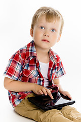 Image showing boy with a Tablet PC. studio