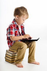 Image showing boy with a Tablet PC. studio