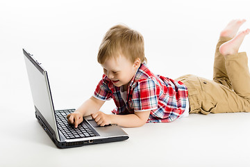 Image showing child with a laptop. studio