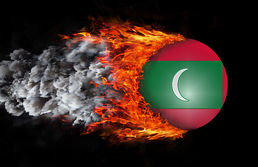 Image showing Flag with a trail of fire and smoke - Maldives