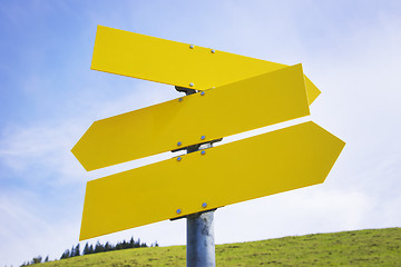 Image showing Three yellow empty arrow signs 