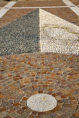 Image showing near mozzate street  abstract   pavement of  curch and wall marb