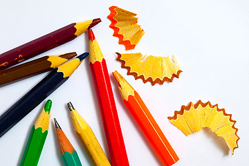 Image showing several vintage pencils and shavings on white