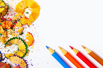 Image showing colored pencils and shavings on white background