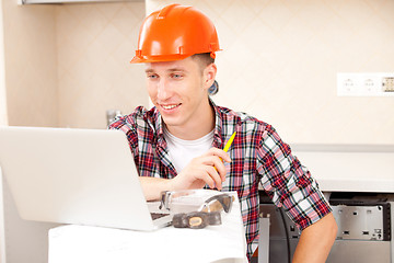 Image showing workers with a laptop