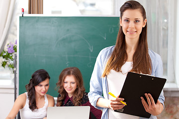 Image showing smiling  girl looking at camera in college