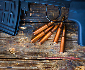 Image showing sniper rifle with a shop and five cartridges