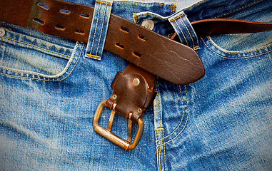 Image showing leather belt on old jeans